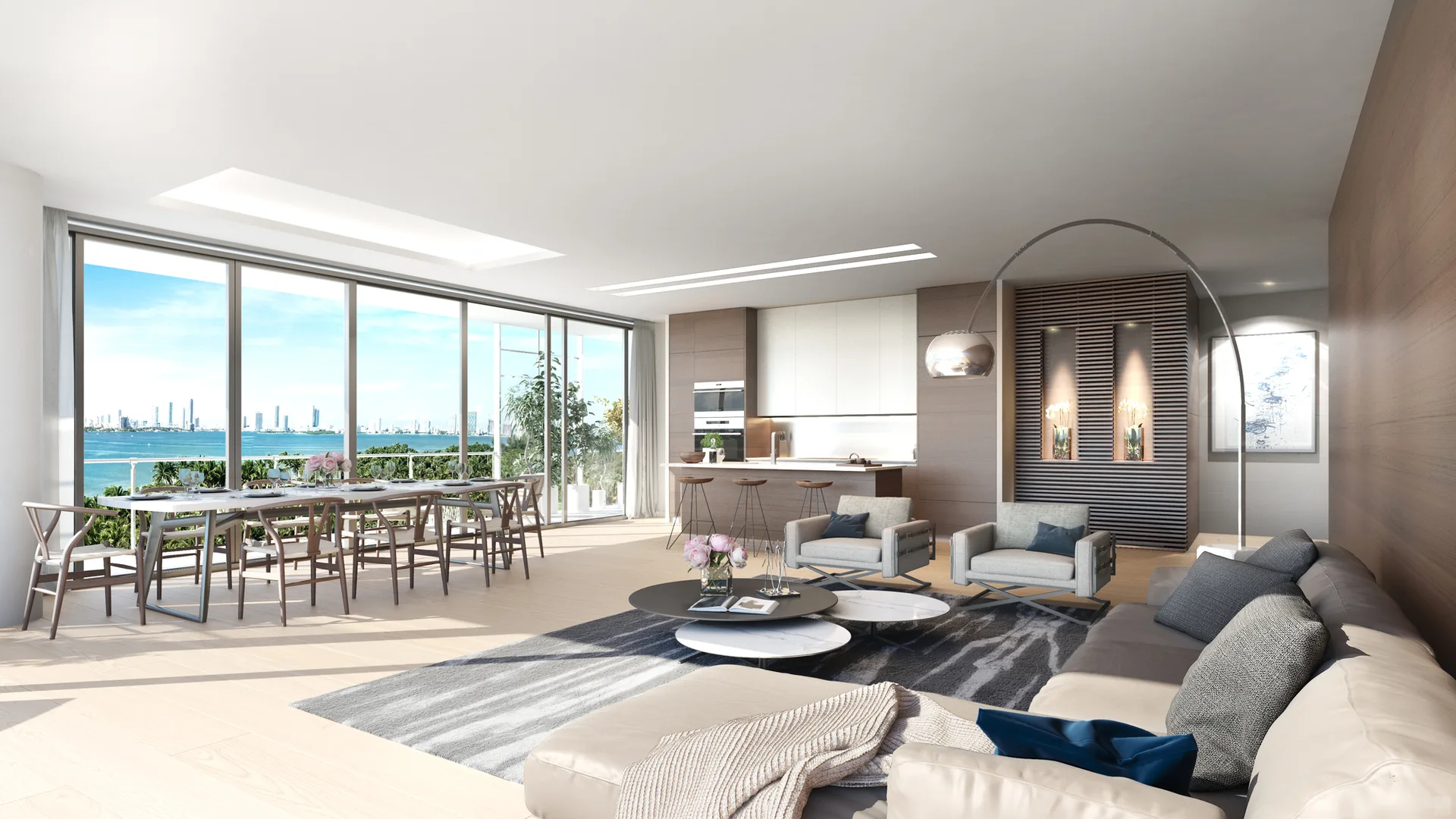 An open-concept living and dining room with floor-to-ceiling windows showing a waterfront view, a slatted wood accent wall, and modular furniture.