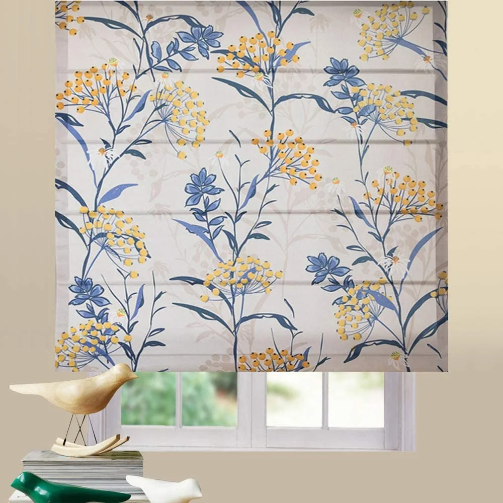 A fabric roman shade with a blue and yellow floral pattern is mounted over a small window.