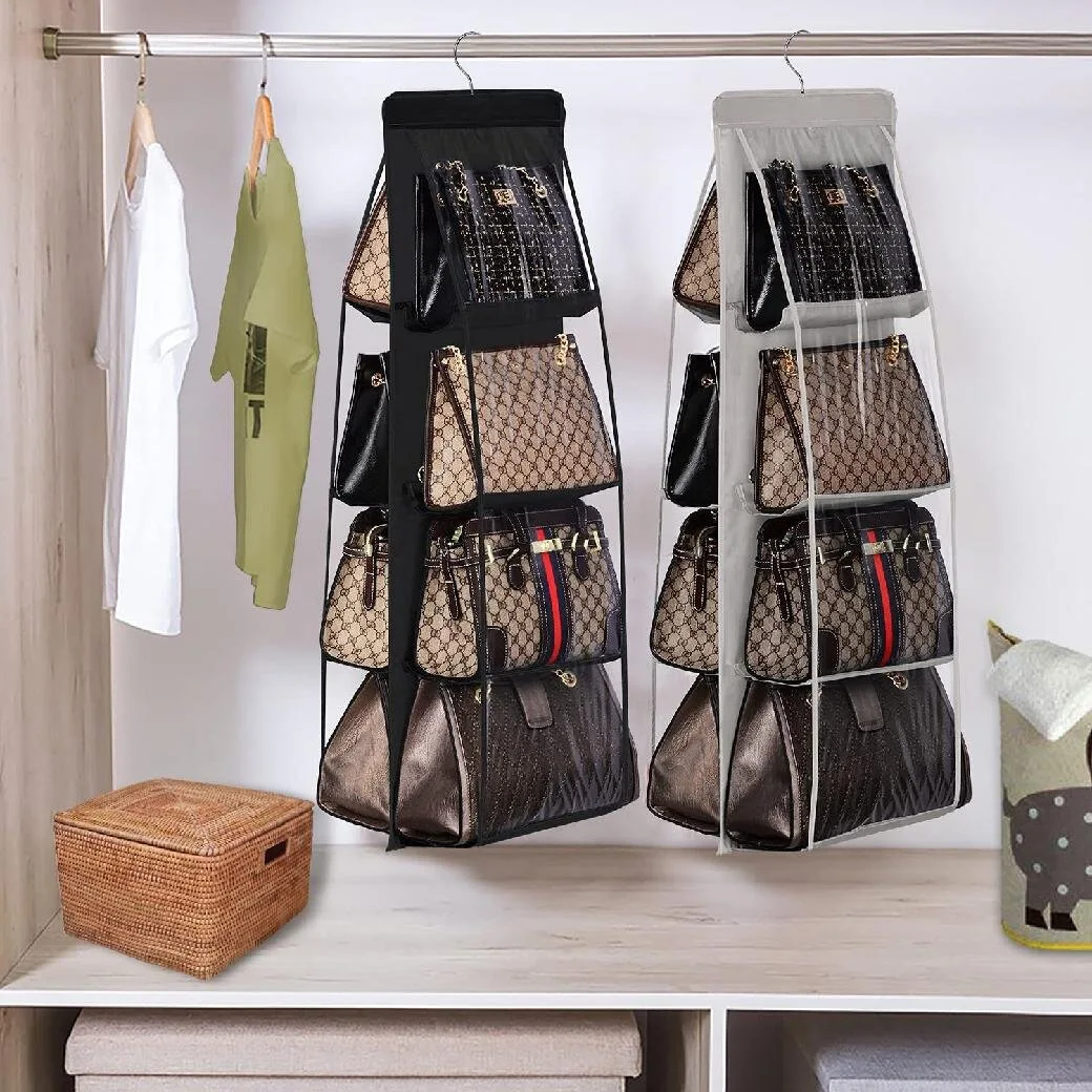 Two hanging fabric handbag organizers with clear compartments hold several purses on a closet rod above a shelf with a wicker basket.