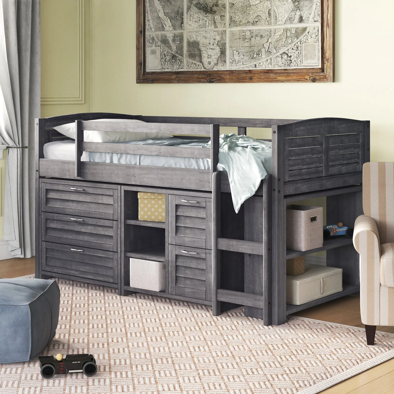 A gray wooden loft bed with built-in storage drawers and shelves sits on a patterned rug next to a striped armchair and a framed wall map.