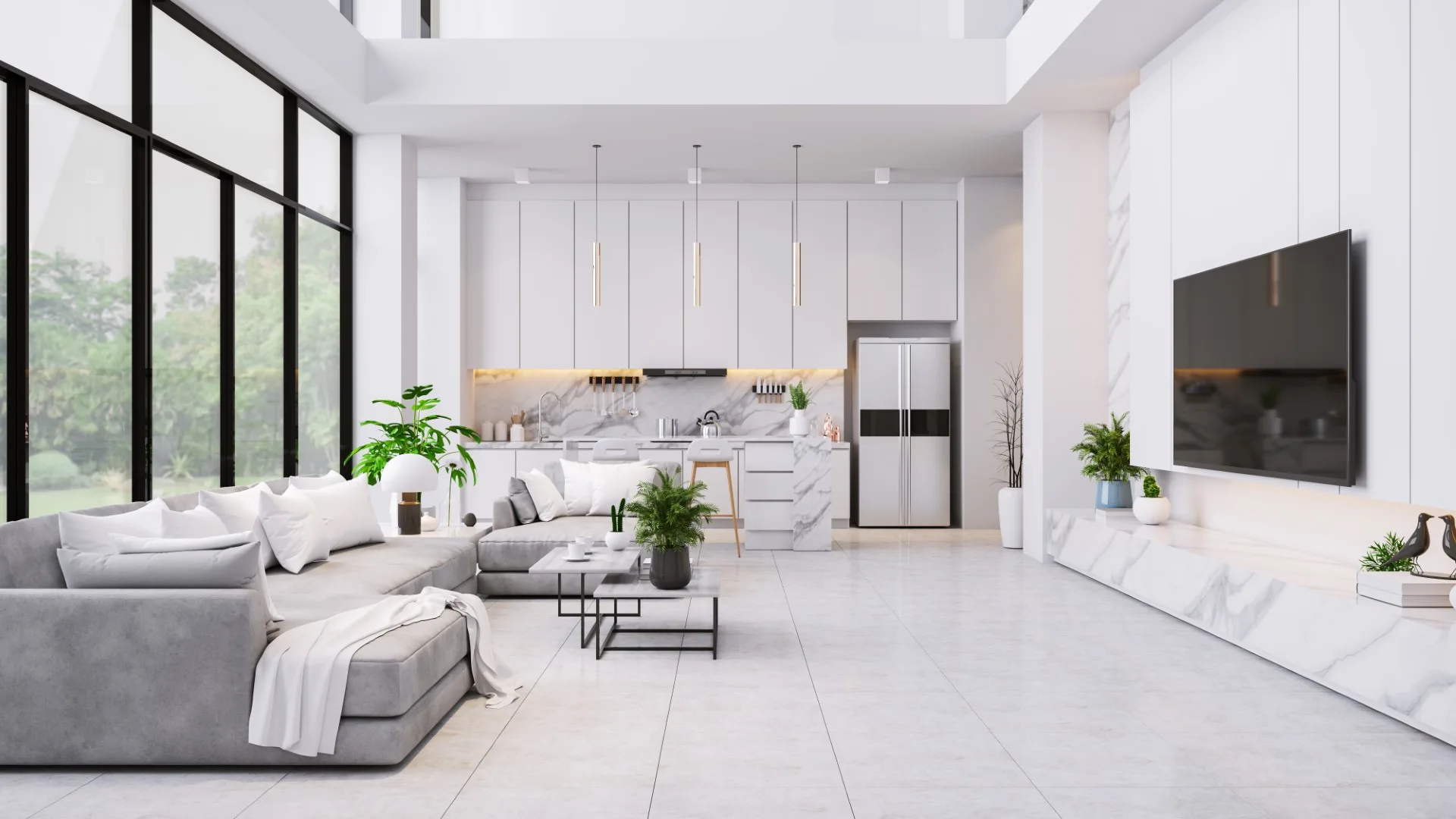 A modern open-concept living room features a grey sectional sofa, marble media console, and a white integrated kitchen with matching marble finishes.