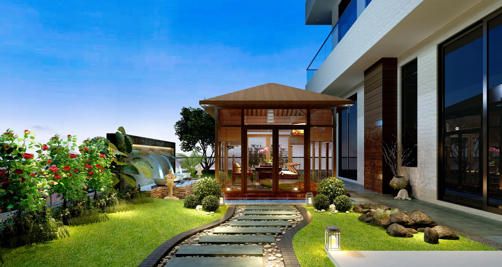 A lit wooden gazebo sits in a landscaped backyard garden with a winding stone pathway, green lawn, and cascading water feature at dusk.