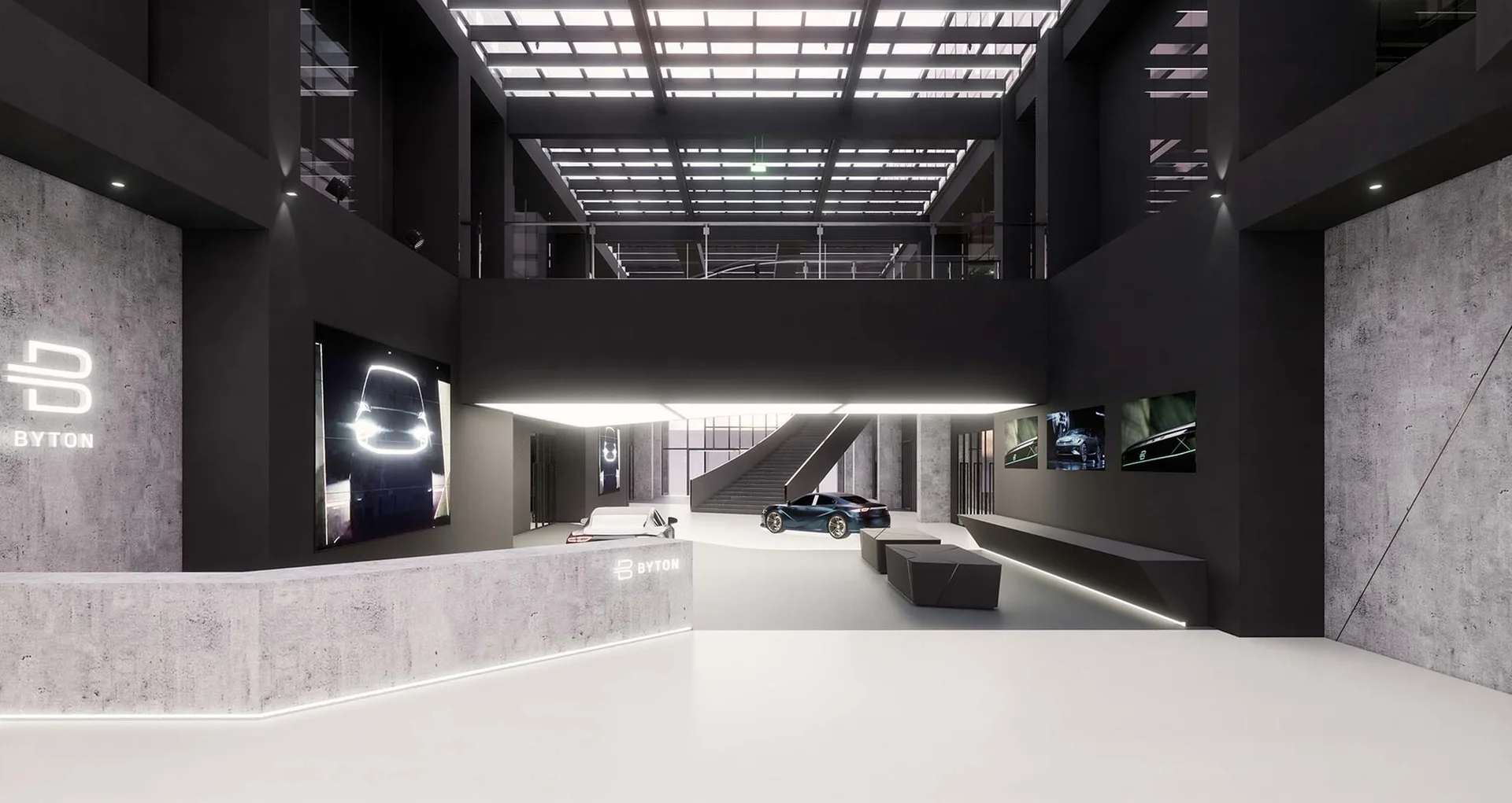 A modern industrial showroom entryway featuring a textured concrete reception desk, matte black walls, a geometric bench, and a grid skylight.