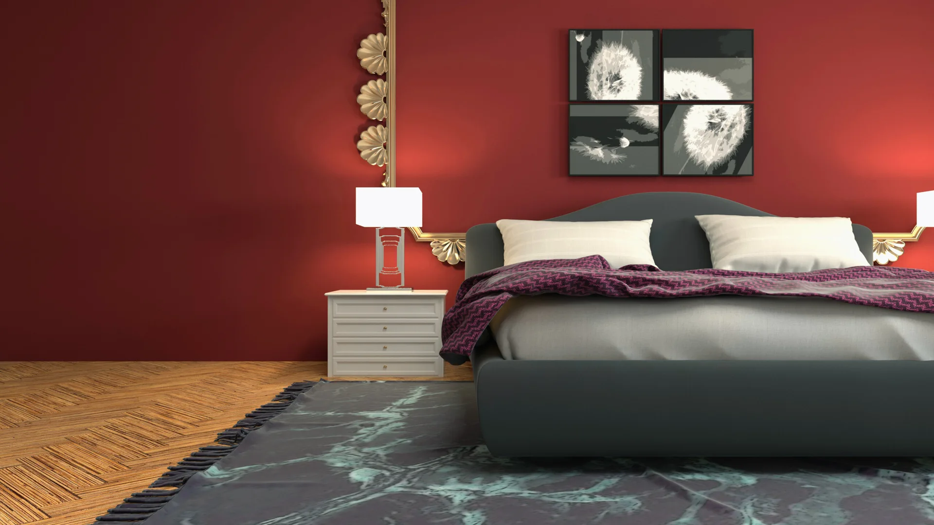 A bedroom features a dark grey upholstered bed against a deep red wall decorated with an ornate gold mirror frame and four square art prints.