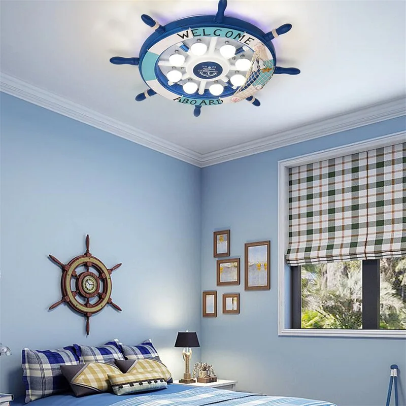 A child's bedroom with light blue walls features a ship wheel ceiling light, checkered Roman shades, and coordinating plaid bedding.