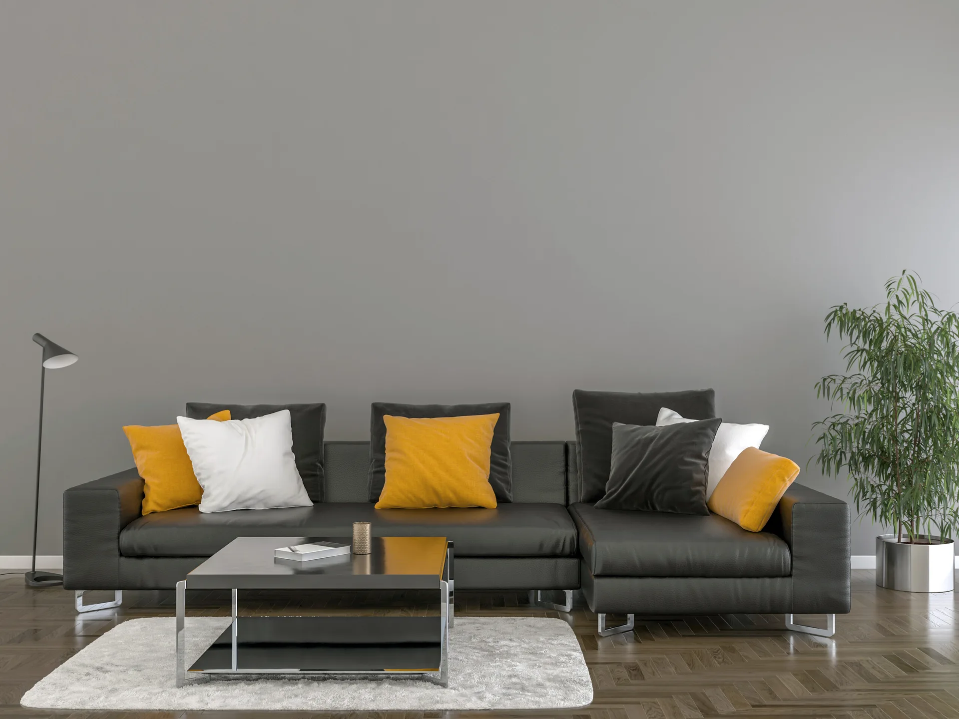 A modern living room features a black leather sectional sofa with yellow pillows, a white rug, and a gray wall on herringbone floors.