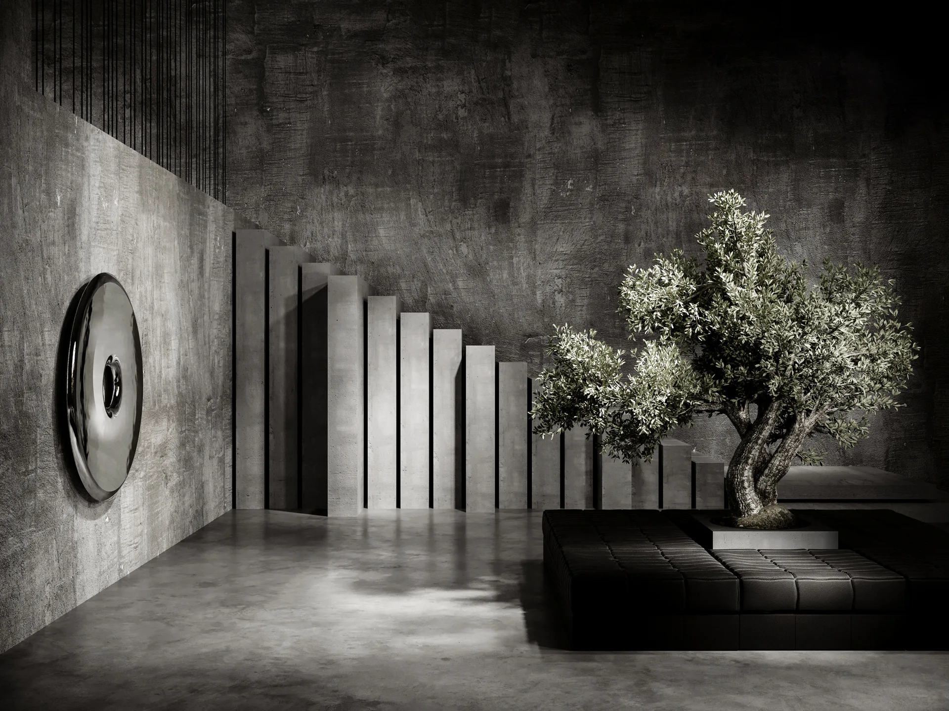 A brutalist concrete lounge featuring a low black tufted bench with a potted tree, a stepped concrete wall, and a circular metallic wall sculpture.