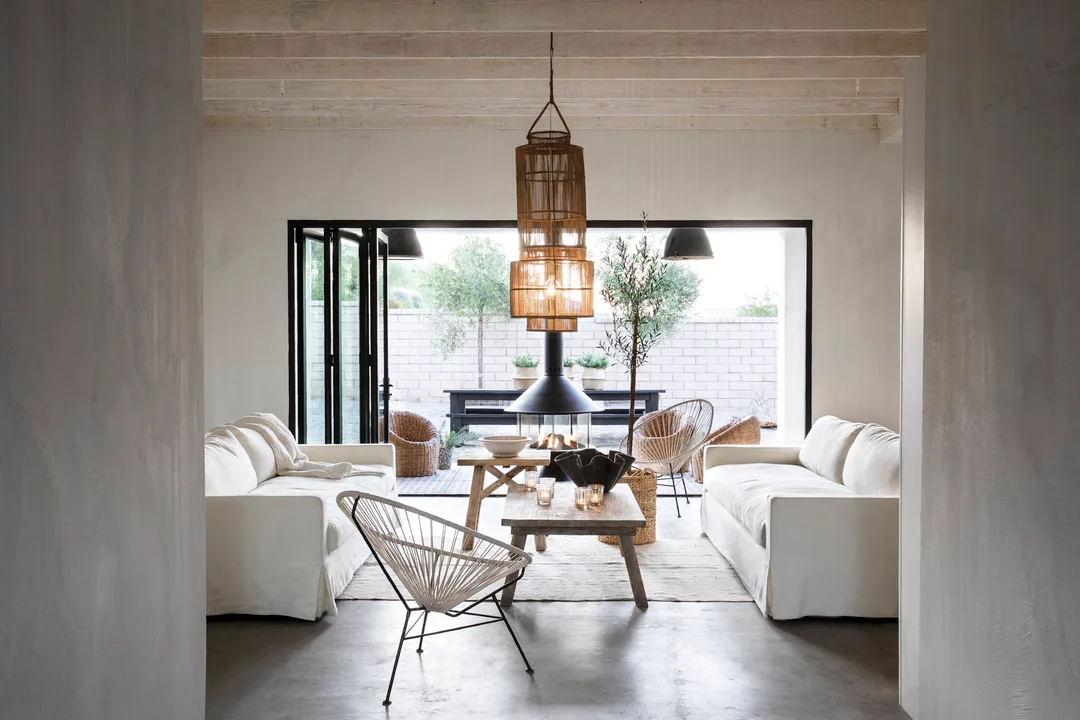 Modern farmhouse living room with raw wood ceiling beams&nbsp;